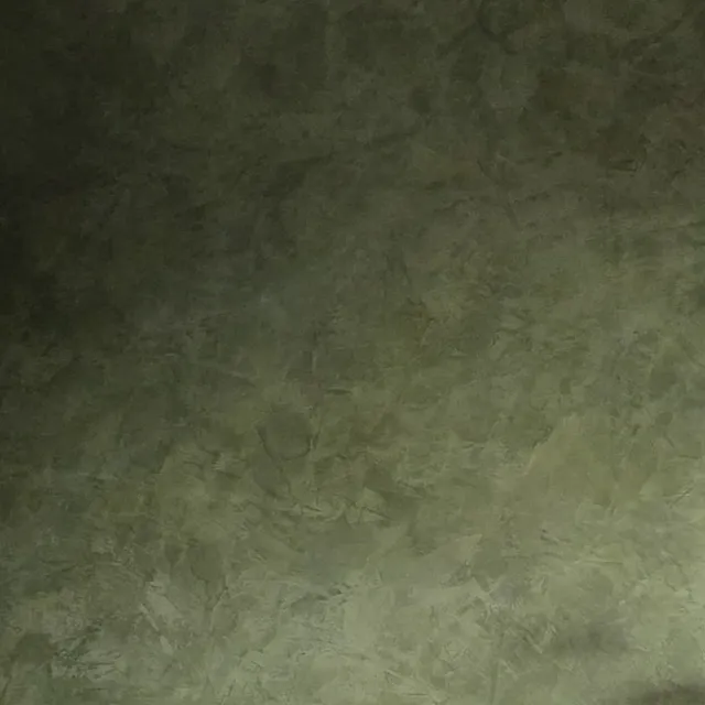Close view of smoky green Ponderosa Roman clay, its soft, uneven movement in low light