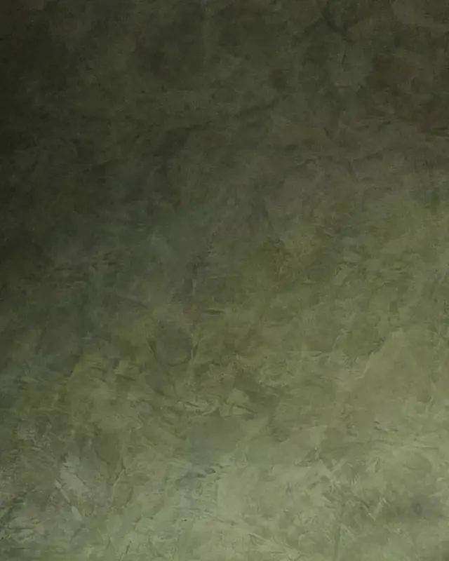Close view of smoky green Ponderosa Roman clay, its soft, uneven movement in low light