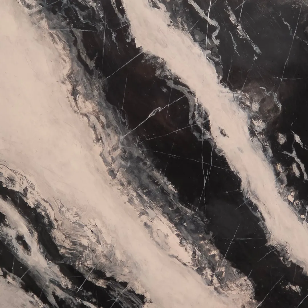 A faux marble sample board, near black, with sweeping white veins and fine gray lines