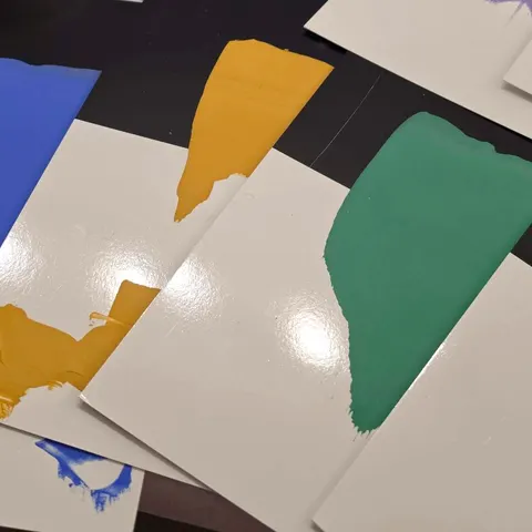 Drawdowns of new colors in blue, yellow, green, and violet, side by side on black and white test cards