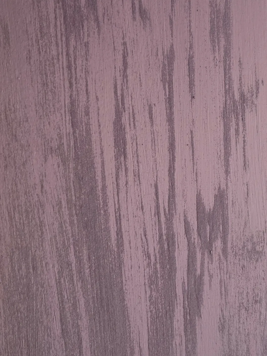 Close view of the lavender finish, with pale streaks running down the wall